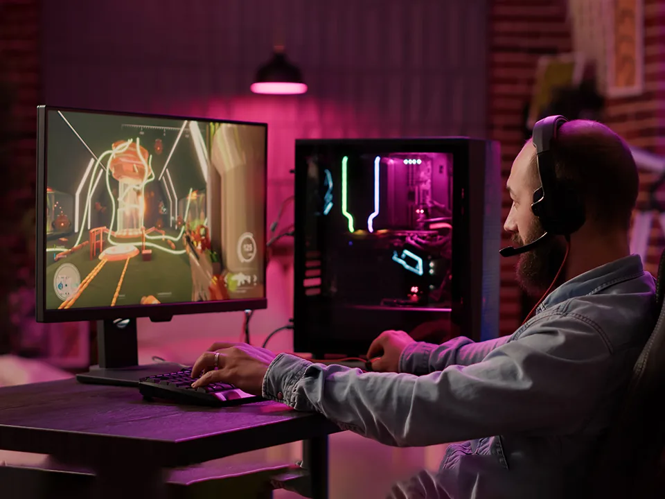 A man playing games on a PC